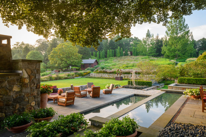 Reflective water feature and patio at InSitu in Redding, Connecticut