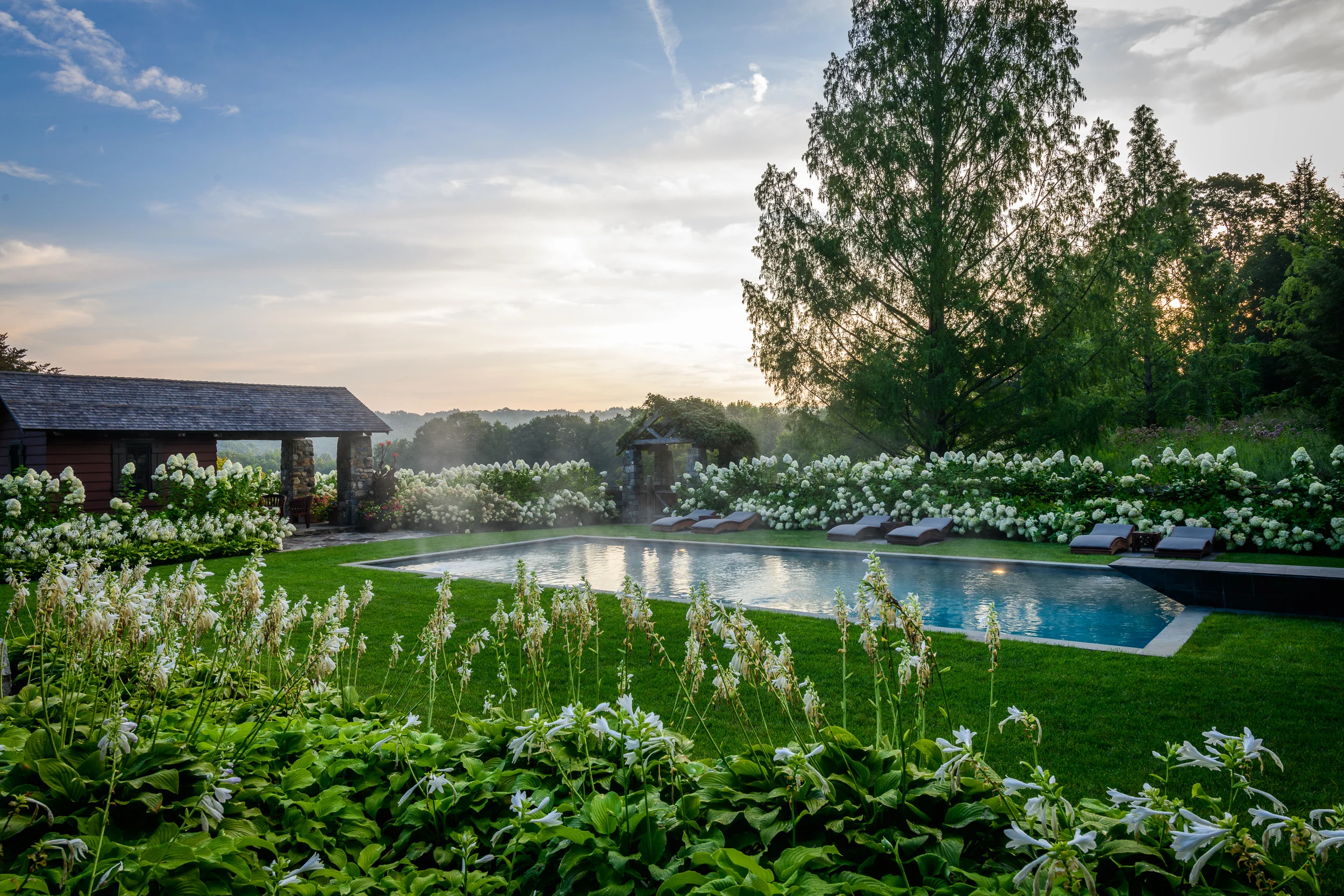 Stone terrace and lawn at InSitu in Redding, Connecticut