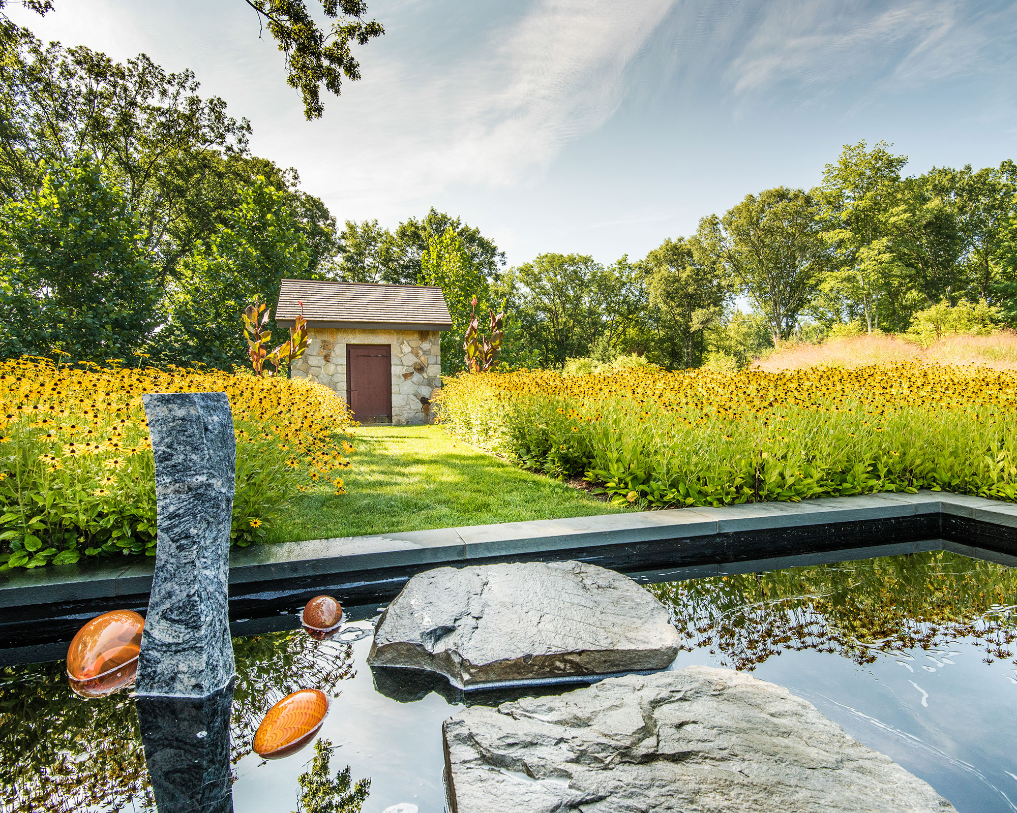 InSitu in Redding, Connecticut with sweeping lawn, terraces, and sculpted landscape